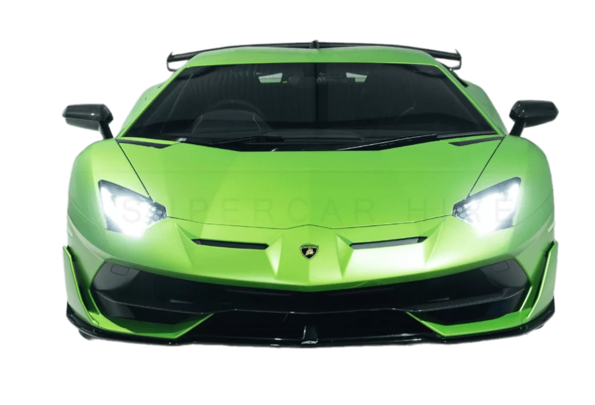 Bright green lamborghini huracán supercar with aggressive styling, including a sharp front splitter and angular headlights, photographed against a black background.
